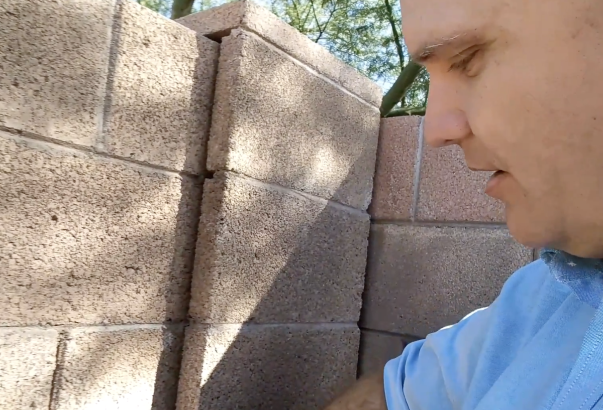 Exterminator-blocking-a-fence